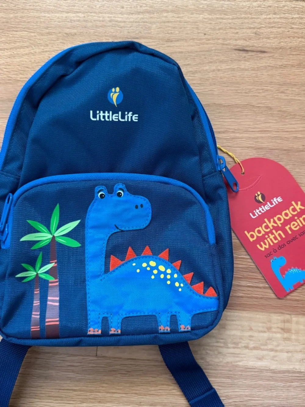 New LittleLife Dinosaur Friendly Faces Toddler Small Backpack with Rein in Blue